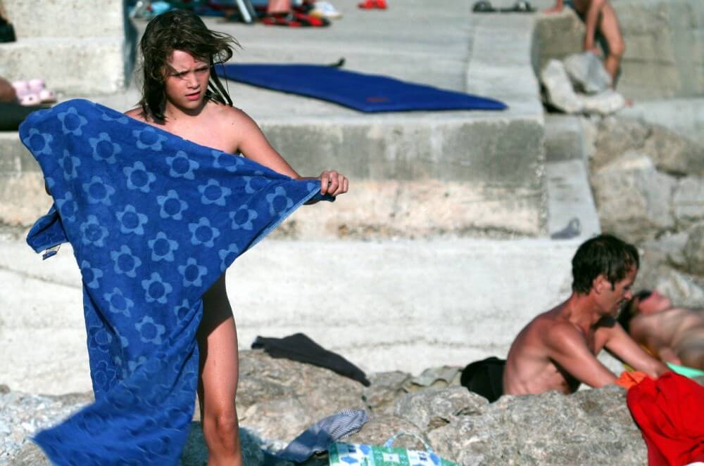 Nudist Rocky Family Angle - A love of the sun and fresh air are important values for those who practice naturism and nudism