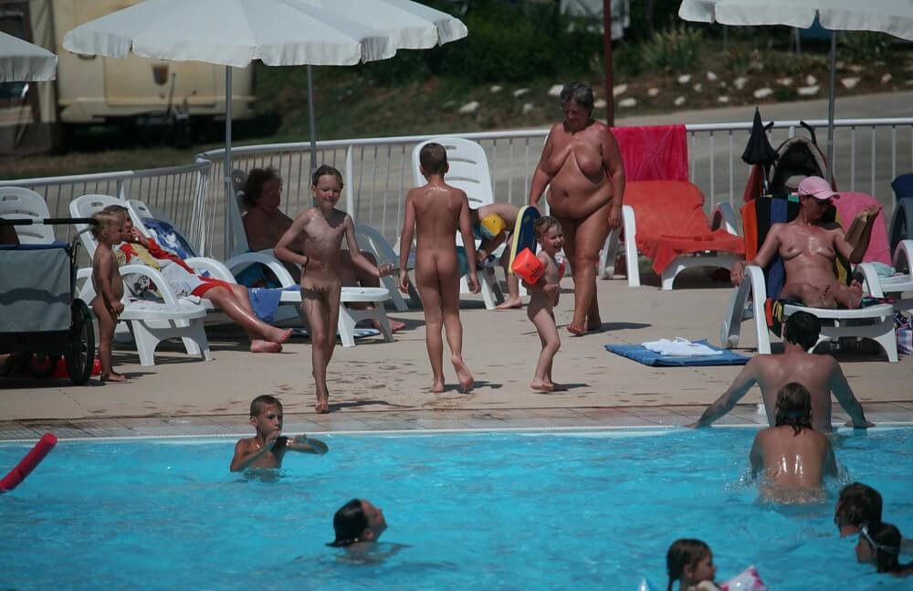 Naturist Afternoon Pool Games pics - Nudism teaches you to appreciate the present