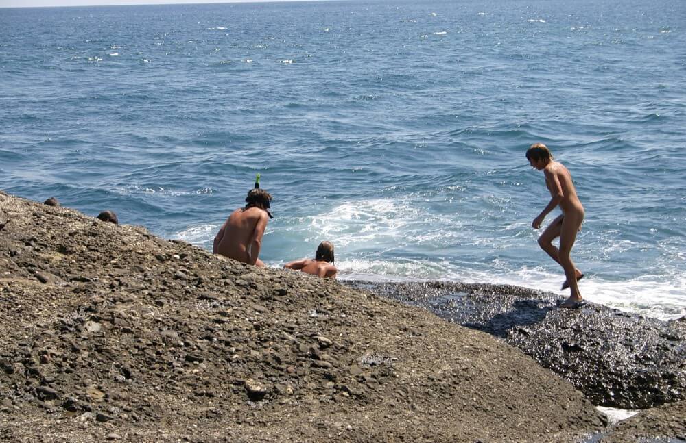 Leaning Against Hit Rocks pics - Nature provides inspiration and energy for the practice of naturism and nudism